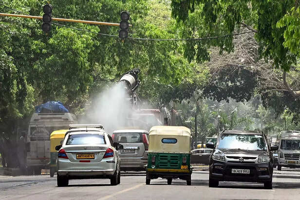 New Delhi, Apr 19 (ANI)_ A water spray vehicle is being used to reduce the surfa....