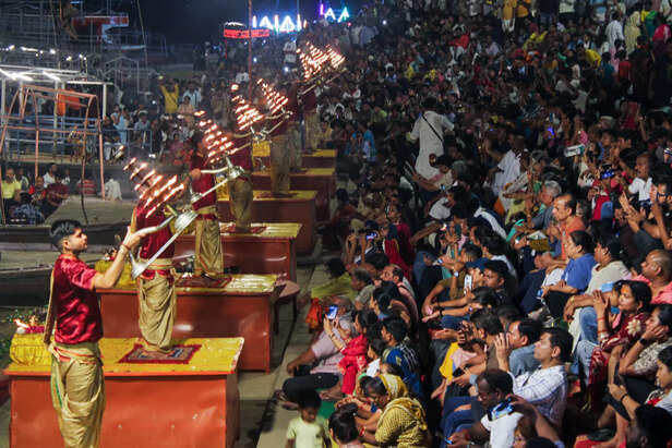 Priests perform Ganga Aarti at Assi Ghat after increase...