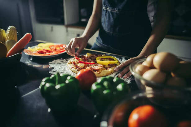 Chef Preparing a Vegetable Pizza