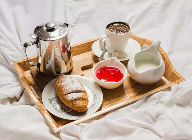 French press next to breakfast