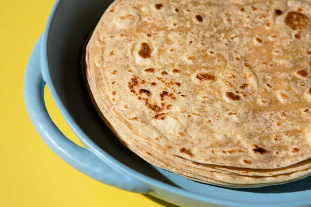 Side-by-side image of a fluffy wheat roti