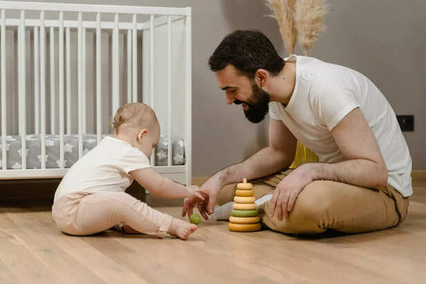 Parent comforting anxious child in a warm, quiet home setting.