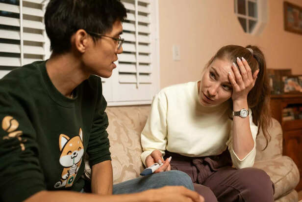 A child expressing concern as a parent listens intently