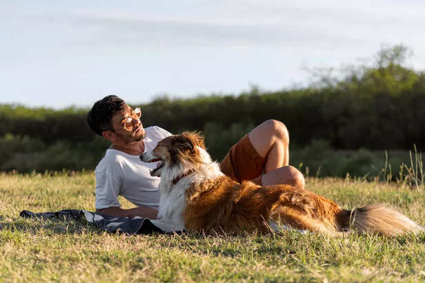 Man sharing a heartfelt moment with his dog