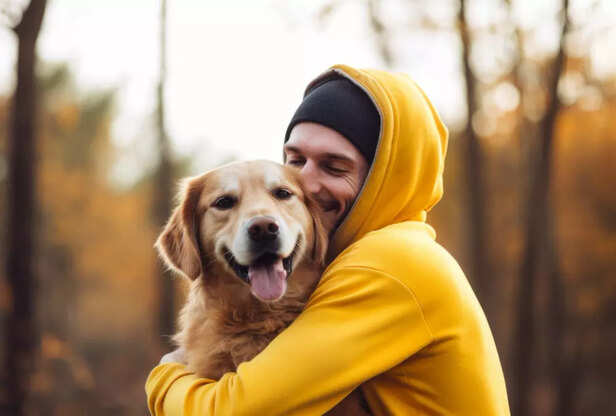 Golden Retriever and Owner Sharing a Loving Hug Outdoors