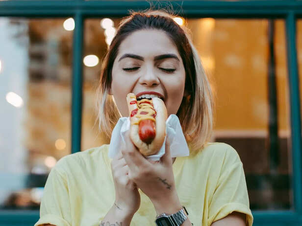 A girl eating happily