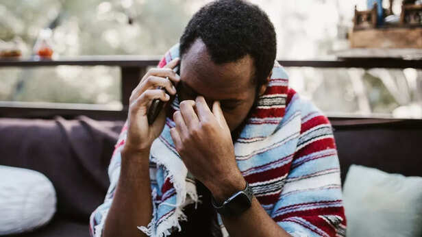 A sad man talking on phone