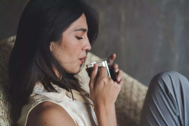 A woman drinking coffee
