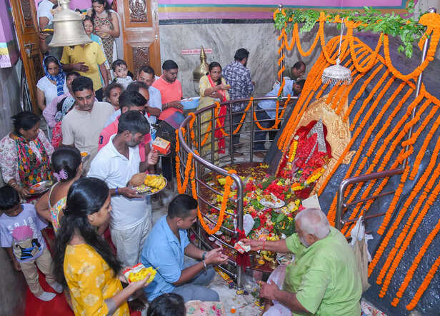 Sonitpur, Aug 27 (ANI): Devotees offer prayers to Lord Ganesha on the occasion o...