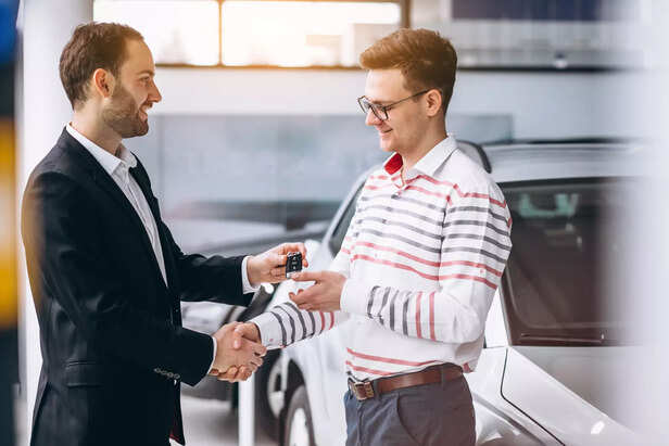 man buying car