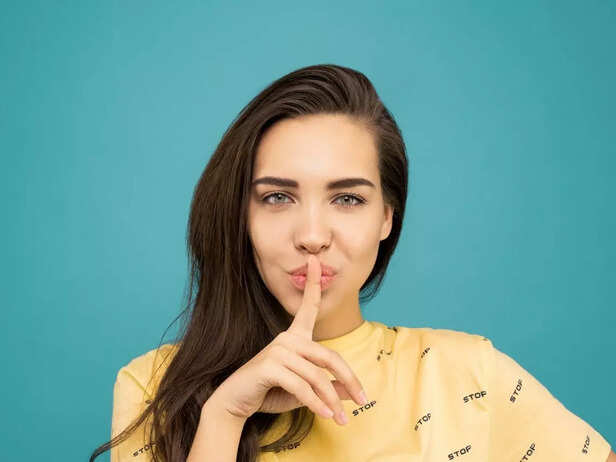 Woman doing "shh" sign