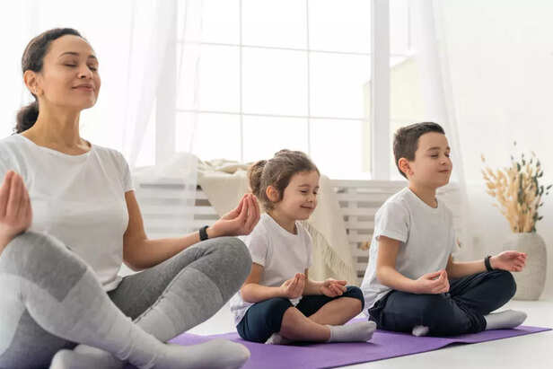 ​Family practicing Gayatri Mantra