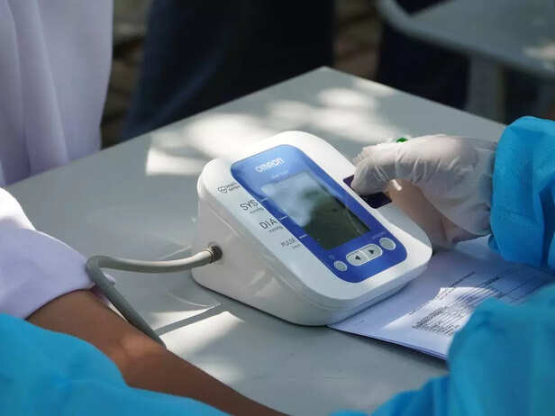 A doctor checking blood pressure