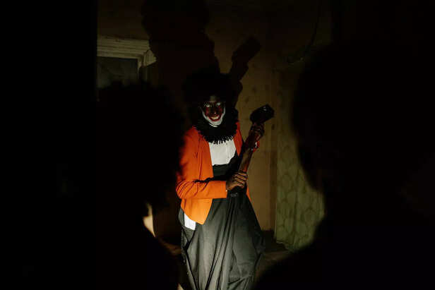 Scary Clown holding a Hammer