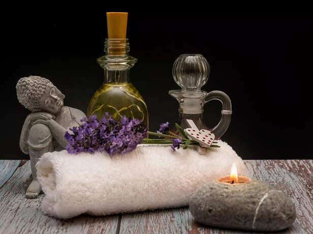 Relaxing buddha statue with lavender