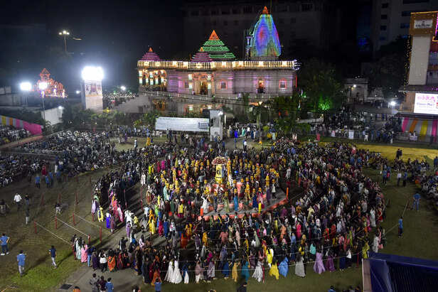 Surat, Sep 25 (ANI): Women balance a holy 'Kalash' on their head and perform "Ga...