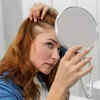 Women looking in mirror
