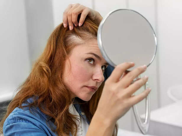 Women looking in mirror