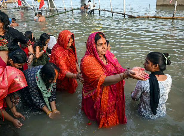 Devotees perform rituals during the Chhath Puja