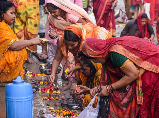 Devotees perform rituals during the Chhath Puja festival
