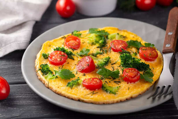 Omelette With Tomatoes and Herbs for Breakfast