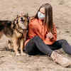 Woman Sitting With Her Newly Adopted Dog Outdoors