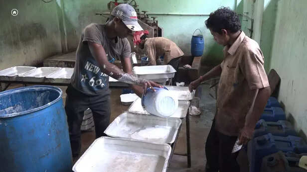 360924-6-locals-busy-in-their-works-at-rubber-processing-plant