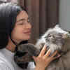 Woman Sharing a Loving Moment With Her Cat