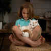 Child Comforting a Cat Showing Trust and Emotional Bond