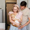 Cat Parents Sharing a Loving Moment With Their Pet Cat