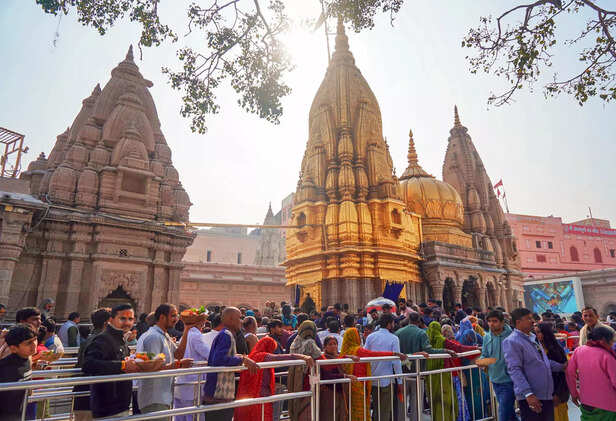 Varanasi, Jan 11 (ANI): Devotees stand in queues at the Kashi Vishwanath Temple ...