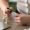 applying coconut oil on nails