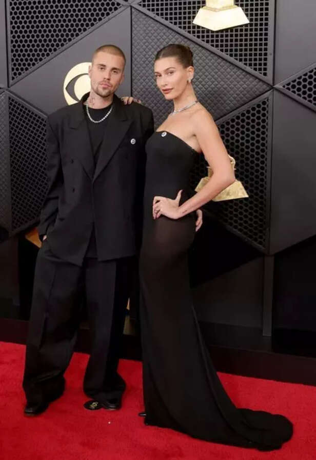 X| @favspopculture| Justin and Hailey Bieber show solidarity for immigrant rights on the Grammys red carpet with ‘ICE Out’ pins