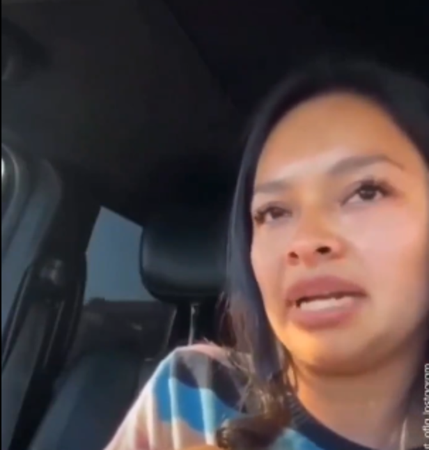 X| A woman livestreams her detention as federal agents surround her vehicle in El Monte, California.