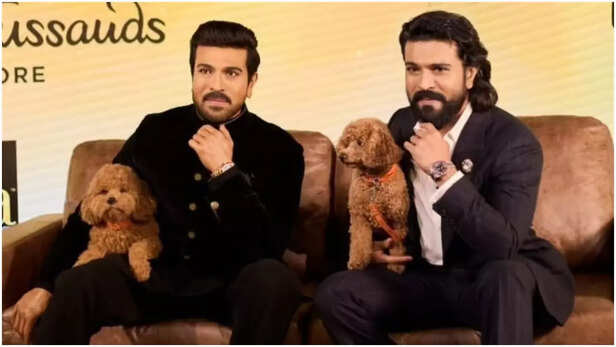 Ram Charan wax statue with pet dog Rhyme