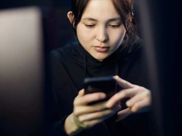 Person scrolling social media on phone
