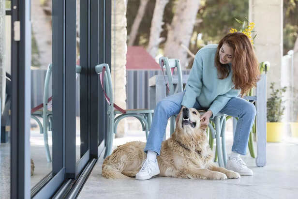 woman petting happy dog
