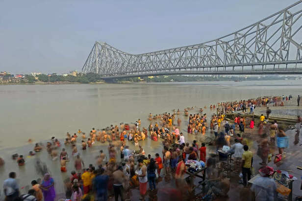 Offering Ganga Jal in temple rituals.