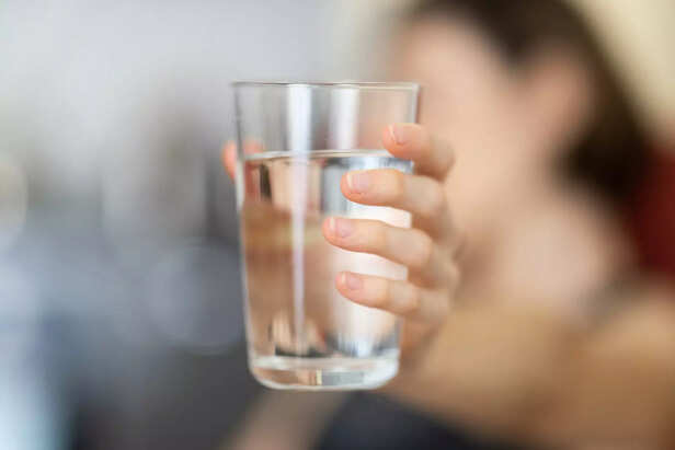 Start your day with a simple glass of water.