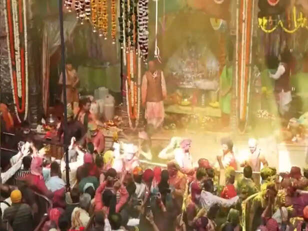 Devotees participate in Holi Utsav at Banke Bihari Temple in Vrindavan