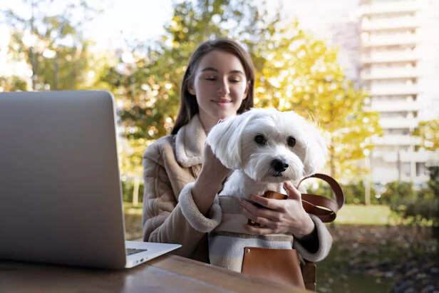 woman holding cute dog