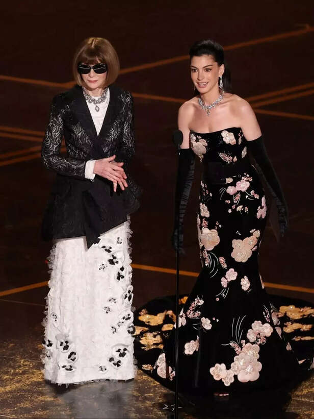 X| @rebecamaccise|  Fans react after Anna Wintour’s viral Academy Awards moment with Anne Hathaway