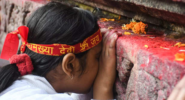 Guwahati, Jan 01 (ANI): A devotee pays obeisance at Kamakhya temple on the first...