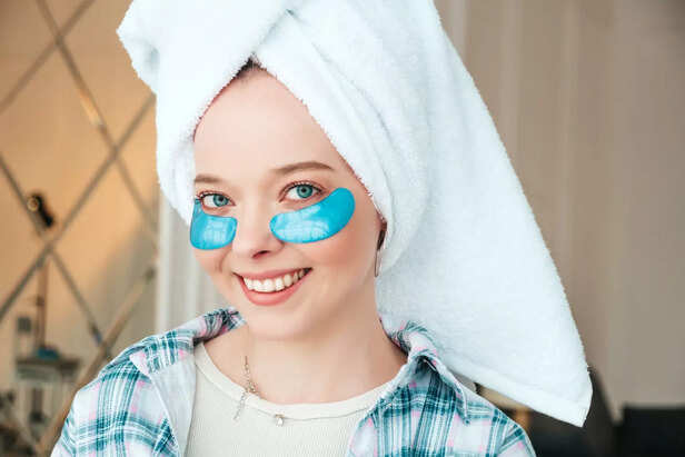Person applying cold compress on eyes