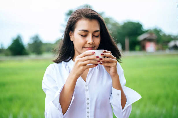 Woman enjoying coriander tea