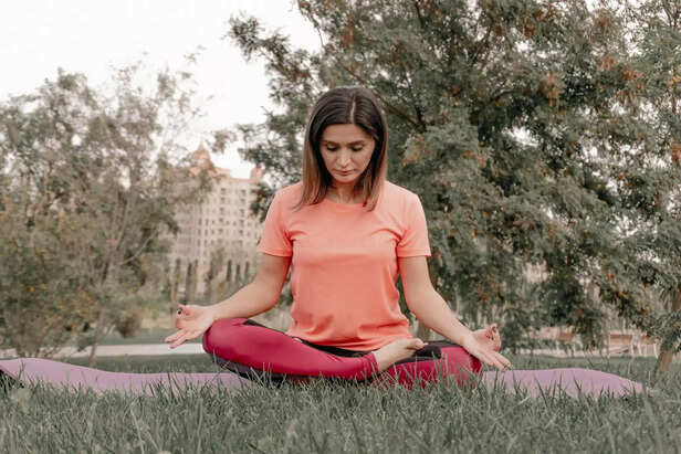 Person meditating in calm environment