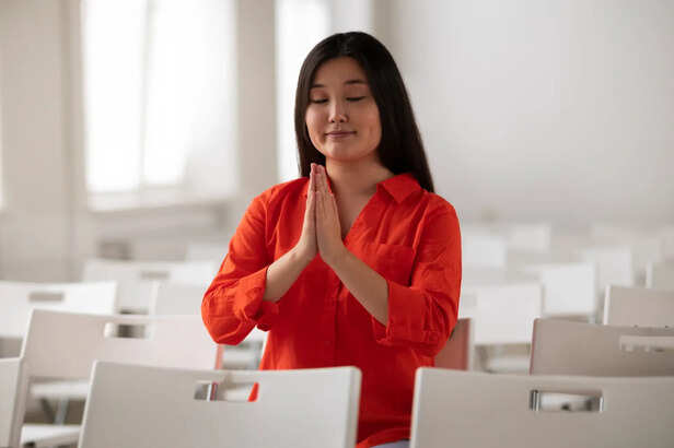 Person Meditating Under Moonlight