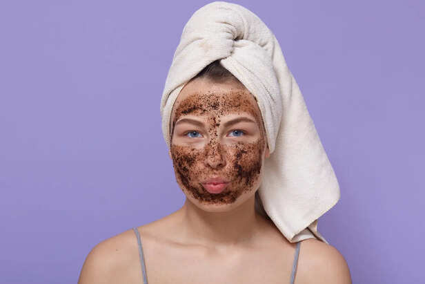 Person Using Harsh Scrub on Face