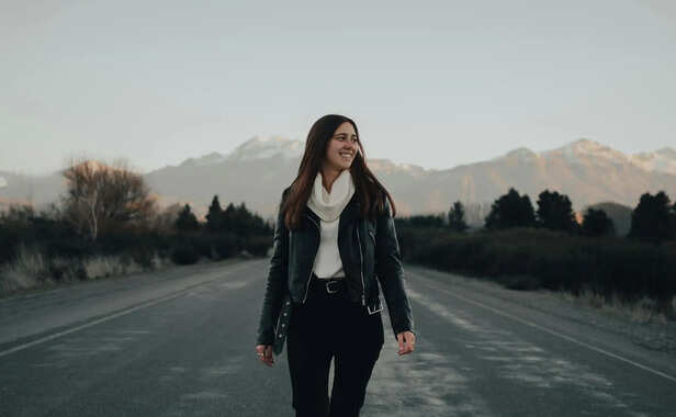 Person walking confidently toward goals