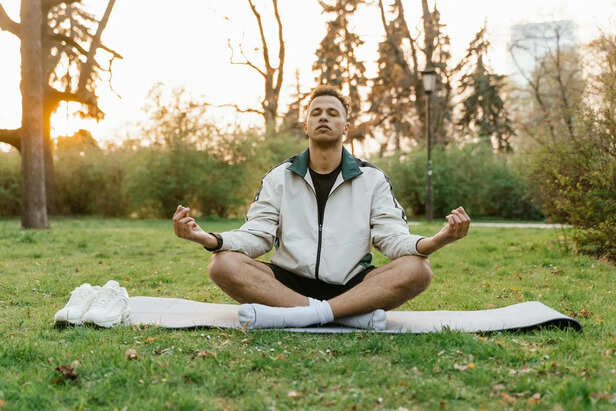 Person meditating in peaceful environment